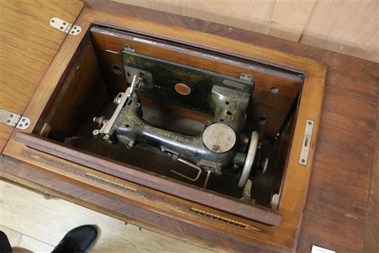 An Excelsior sewing machine within table W.95cm